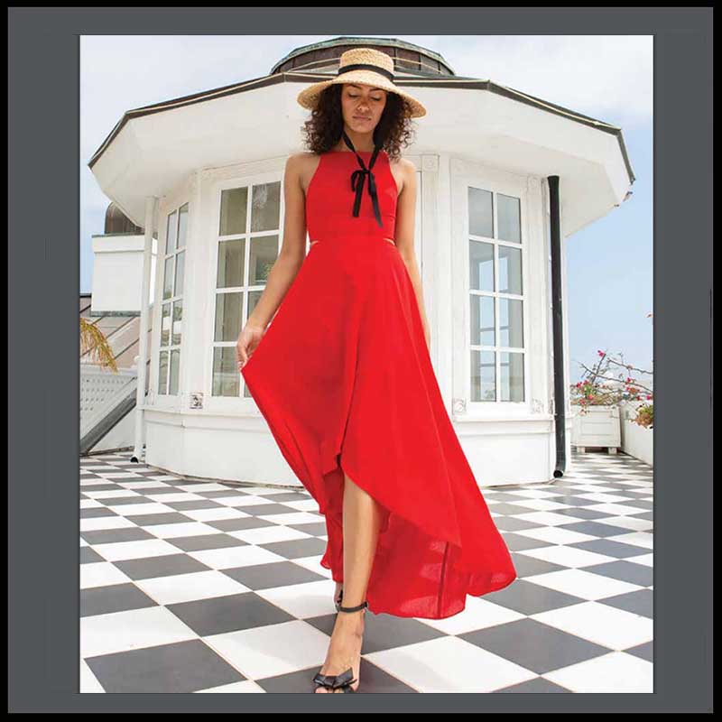 Women in stunning red dress wears a straw hat. No matter what occasion you are dressing for a hat will always add a little extra to your outfit, show a little more of your personality, add a little confidence, proves you thought about the tiniest details