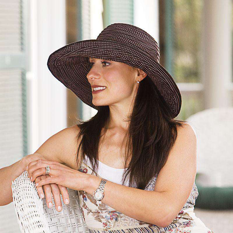 Womens in a shapeable brim hat with wire edge. Brim is turned up on one side. Shapeable hats allow you find your unique style to match your personality and sun protection need.