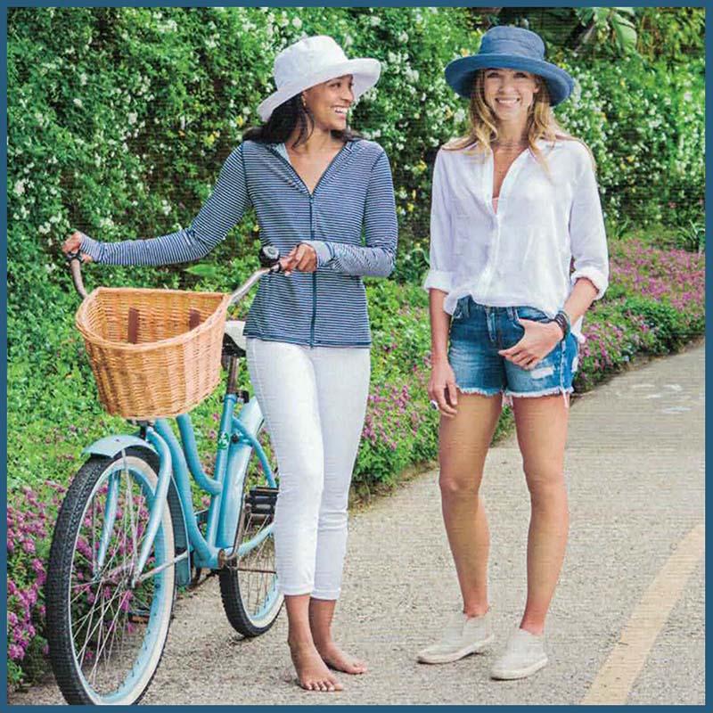 Summer hats for women. Sun protection rated straw and cloth summer hats. Women wearing cotton summer hats.
