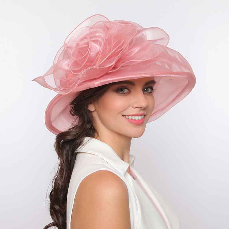 In case you need to pack your fancy hats, choose an organza hat. Women in pink organza fancy dress hat