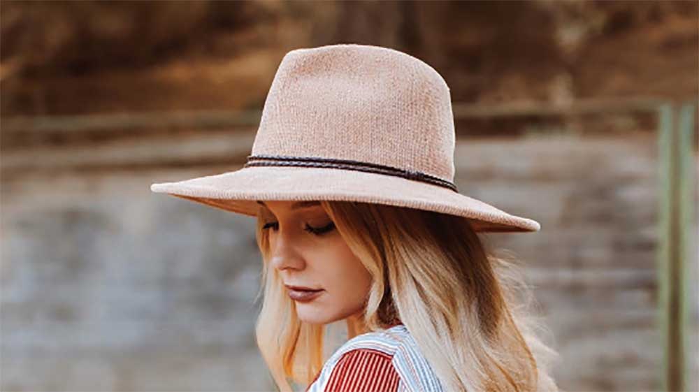 women wears a knit safari hat