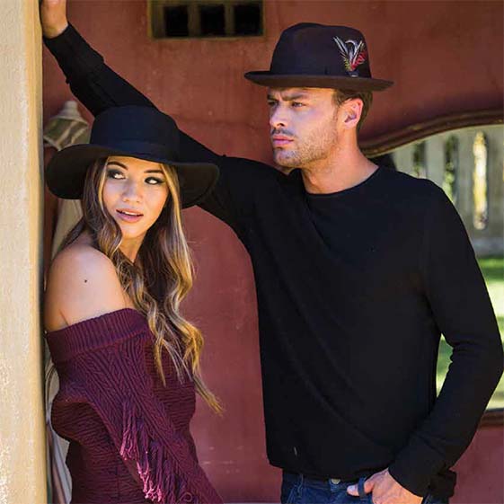 Man and woman wearing wool felt hats, Woman bolero, men fedora hat