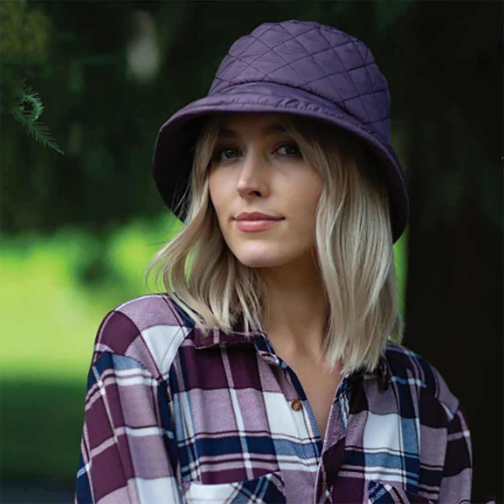 RAIN HATS. Packable rain hats to be ready at the first drop of rain. Women in plum color, quilted rain hat